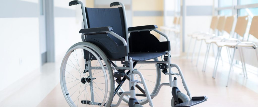 Empty wheelchair in hospital corridor